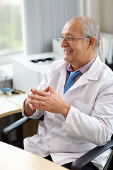 Image showing happy smiling doctor at medical office in hospital