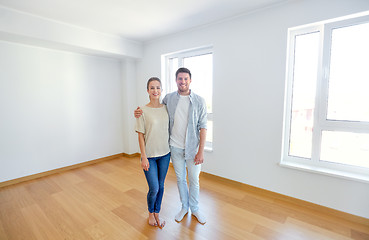 Image showing happy couple hugging at new home