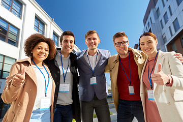 Image showing business team with conference badges in city