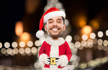 Image showing man in santa claus costume over christmas lights