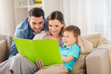 Image showing happy family reading book at home