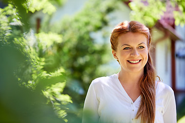 Image showing happy smiling woman at summer garden