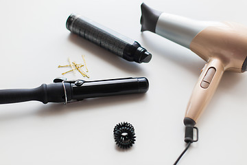 Image showing hairdryer, styler or curling iron and hair spray