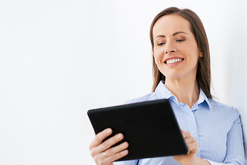 Image showing businesswoman with tablet pc working at office