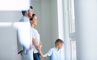 Image showing happy family with child at new home or apartment