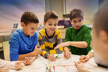 Image showing happy kids with invention kit at robotics school