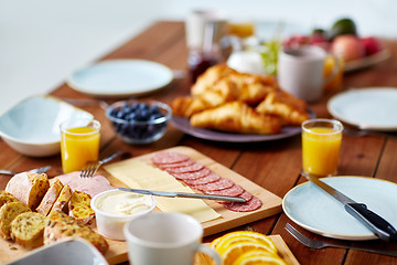 Image showing food on served wooden table at breakfast