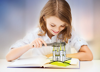 Image showing girl with magnifier reading fairytale book