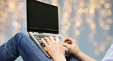 Image showing close up of man typing on laptop keyboard