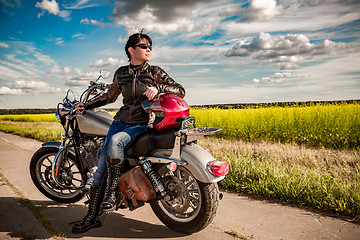 Image showing Biker girl on a motorcycle