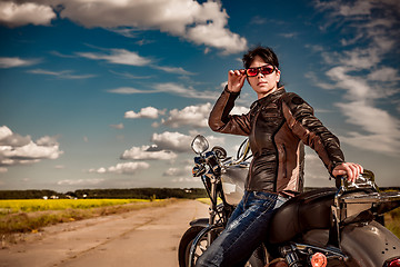 Image showing Biker girl on a motorcycle