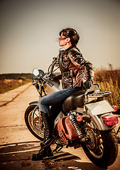 Image showing Biker girl on a motorcycle