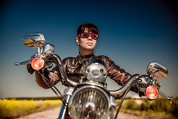 Image showing Biker girl on a motorcycle