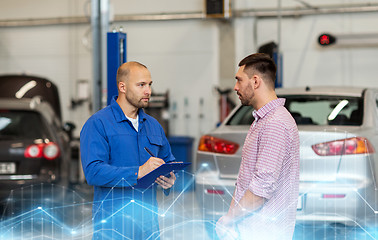 Image showing auto mechanic with clipboard and man at car shop