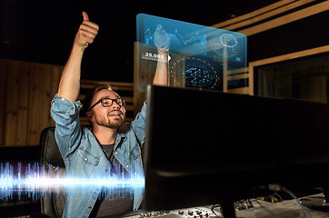 Image showing man at mixing console in music recording studio