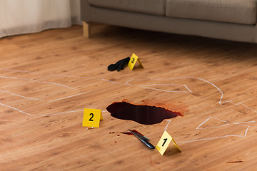 Image showing chalk outline and knife in blood at crime scene