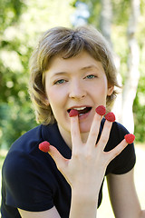 Image showing woman with raspberries