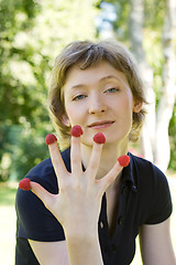 Image showing woman with raspberries