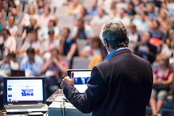 Image showing Public speaker giving talk at Business Event.