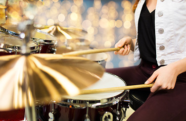 Image showing close up of woman drummer playing drum kit