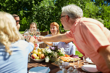 Image showing happy family having dinner or summer garden party