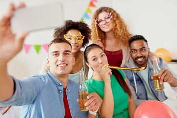 Image showing happy team taking selfie at office party