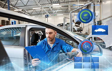 Image showing mechanic man with diagnostic scanner at car shop