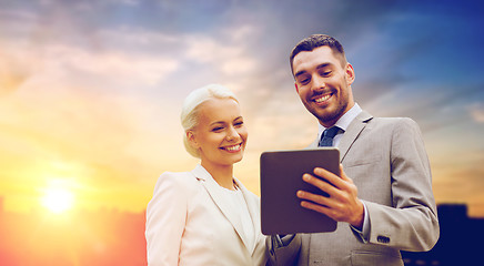 Image showing smiling businessmen with tablet pc outdoors