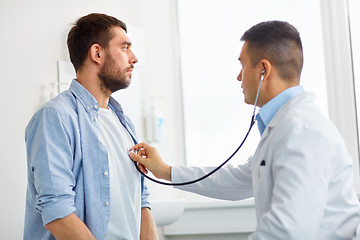 Image showing doctor with stethoscope and patient at hospital