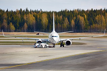 Image showing Airliner at an airport taxiway