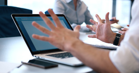 Image showing group of business people having a meeting in bright office