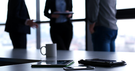 Image showing tablet, mobile cell phone and cup of coffee  in office with busi