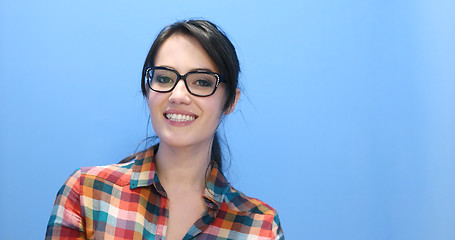 Image showing woman smiling wearing on a pair of large glasses