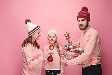 Image showing Father and mother give gifts to little daughter at studio