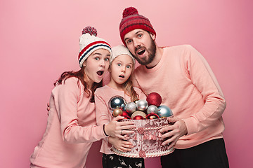 Image showing Father and mother give gifts to little daughter at studio