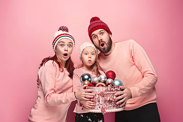 Image showing Father and mother give gifts to little daughter at studio