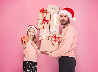 Image showing Father and mother give gifts to little daughter at studio