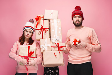 Image showing Father and mother give gifts to little daughter at studio