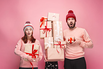 Image showing Father and mother give gifts to little daughter at studio