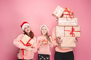 Image showing Father and mother give gifts to little daughter at studio