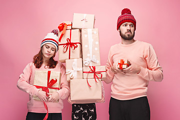 Image showing Father and mother give gifts to little daughter at studio