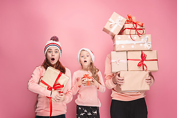 Image showing Father and mother give gifts to little daughter at studio