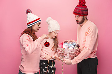 Image showing Father and mother give gifts to little daughter at studio