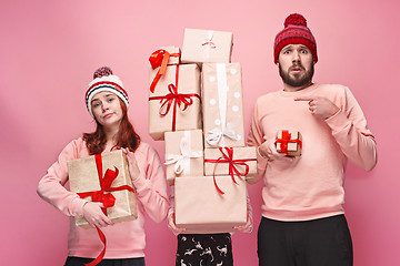 Image showing Father and mother give gifts to little daughter at studio