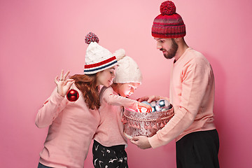 Image showing Father and mother give gifts to little daughter at studio