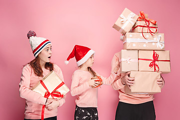 Image showing Father and mother give gifts to little daughter at studio