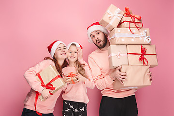 Image showing Father and mother give gifts to little daughter at studio