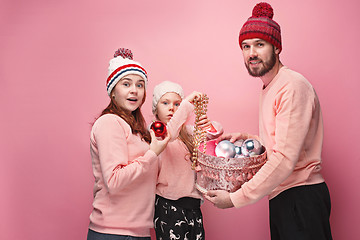 Image showing Father and mother give gifts to little daughter at studio