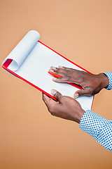 Image showing Male hand holding pen, isolated