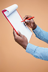 Image showing Male hand holding pen, isolated